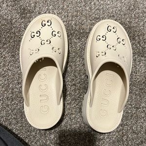 Gucci women’s platform perforated G sandal - Off-White color